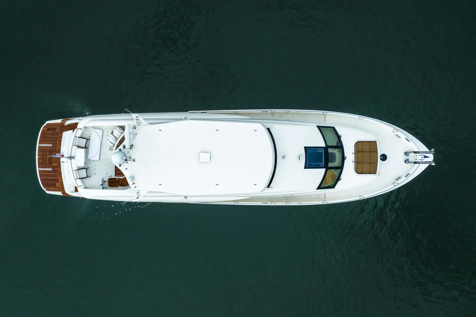 a white boat in the water aboard STARFIRE Yacht for Sale