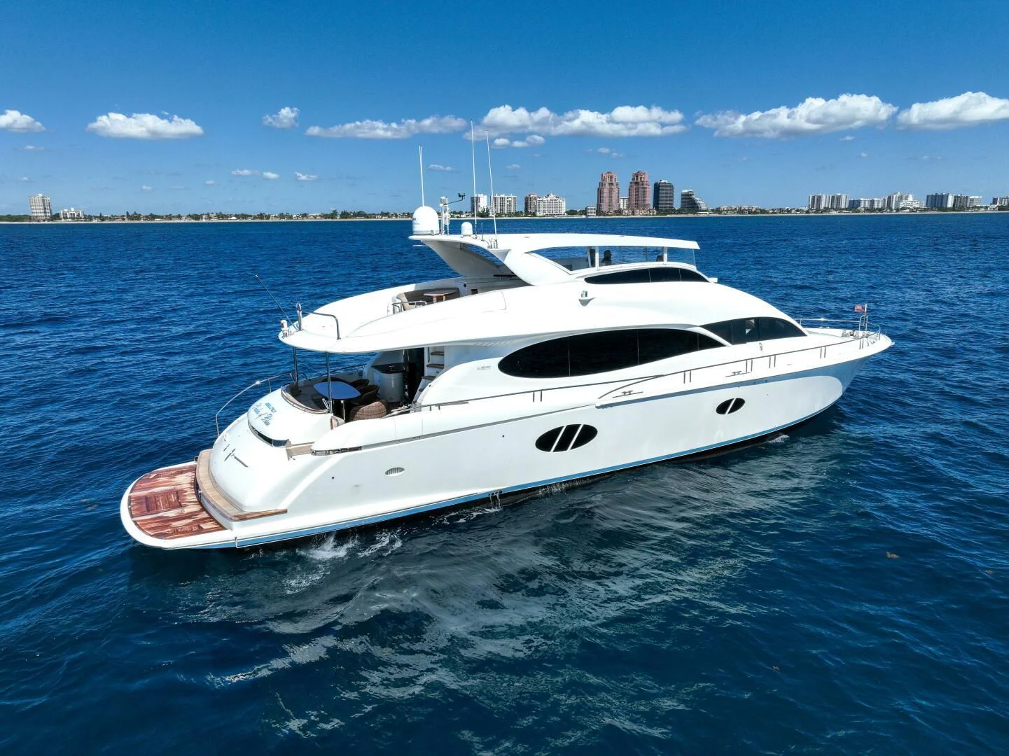 a white yacht in the water aboard STARFIRE Yacht for Sale