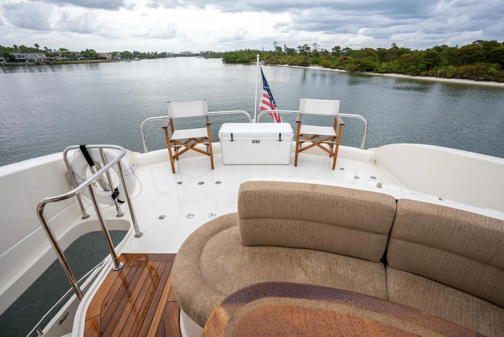 a boat with chairs on it aboard STARFIRE Yacht for Sale