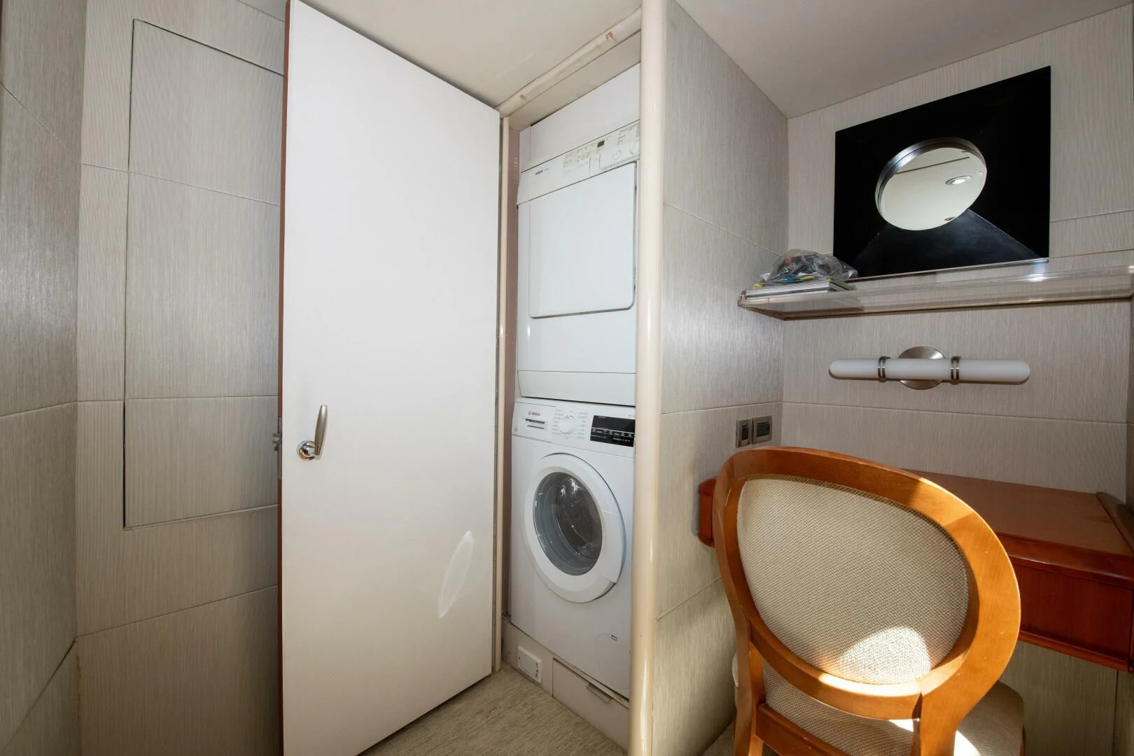 a small room with a washing machine and dryer aboard STARFIRE Yacht for Sale