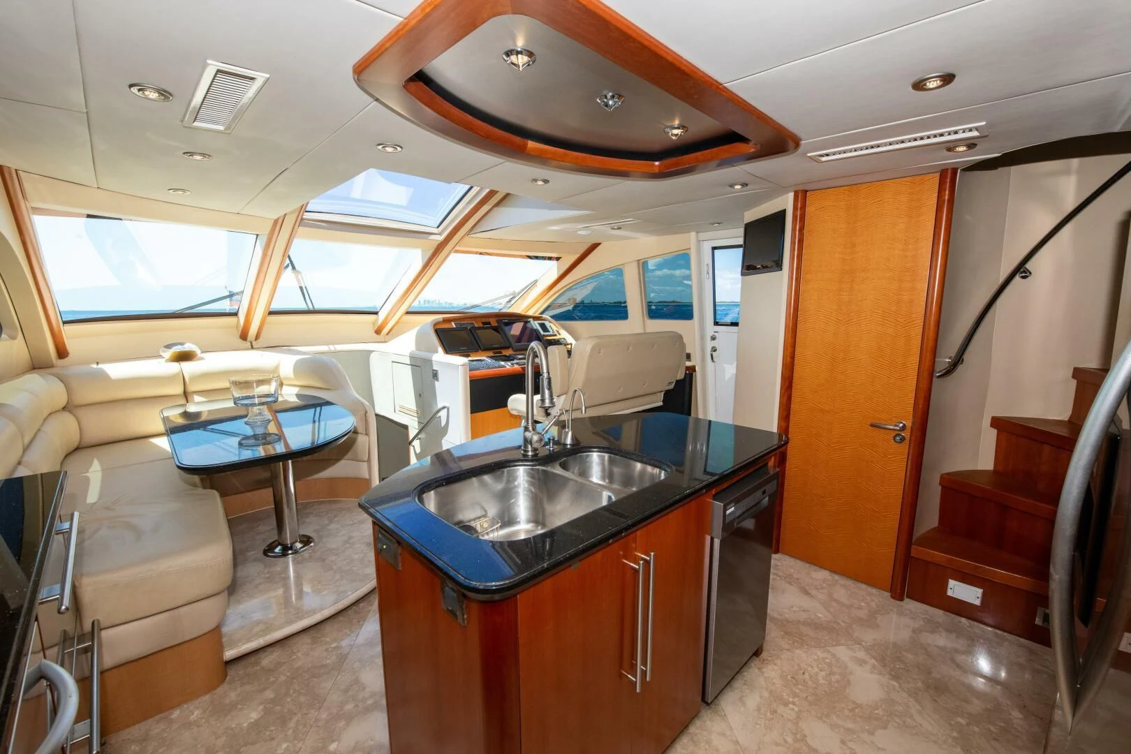 a kitchen with a sink and a table aboard STARFIRE Yacht for Sale