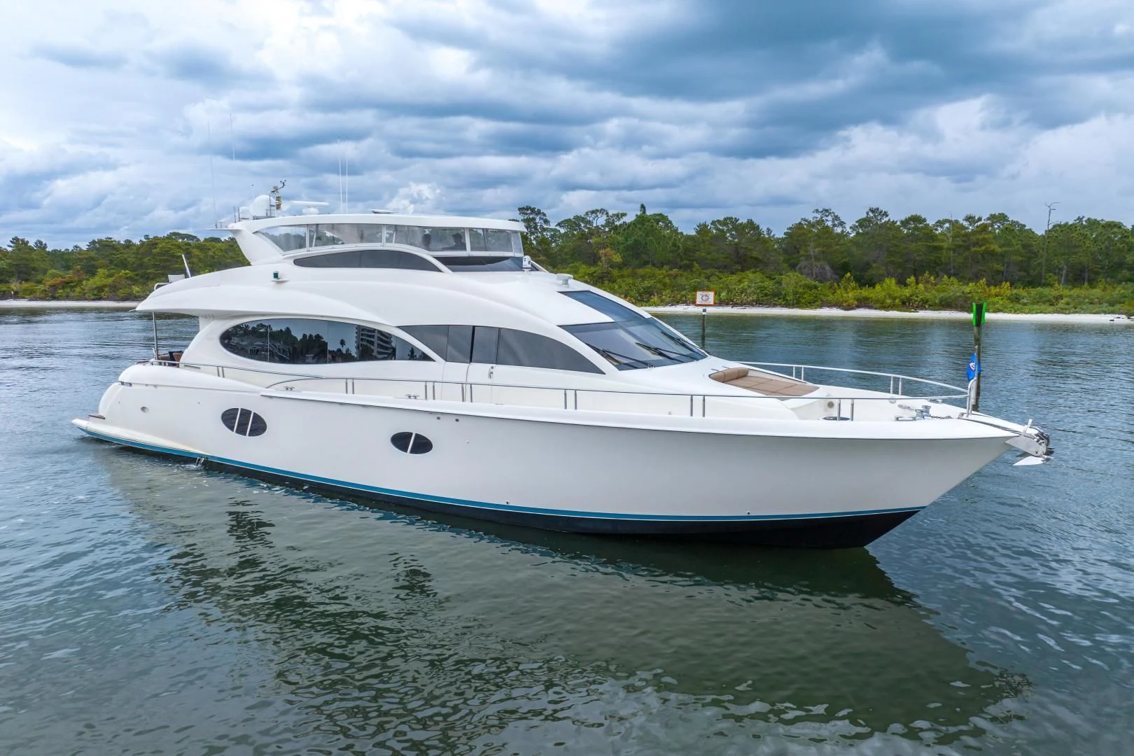 a white boat in the water aboard STARFIRE Yacht for Sale