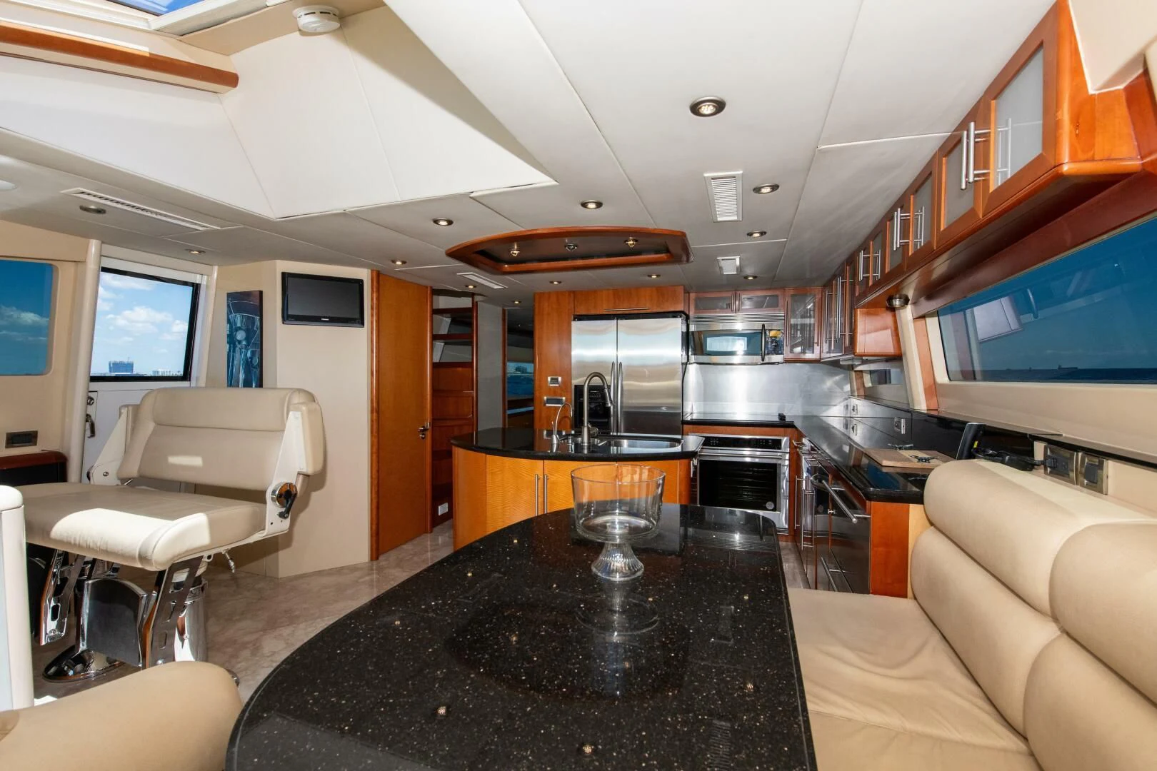 a large kitchen with a bar and bar area aboard STARFIRE Yacht for Sale