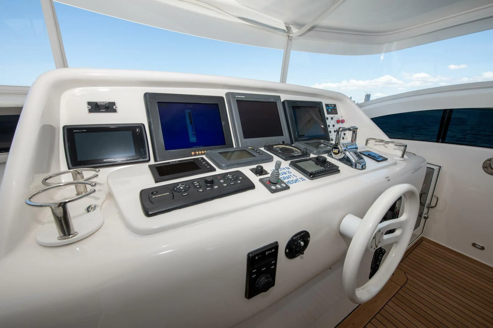 a white car with multiple monitors aboard STARFIRE Yacht for Sale