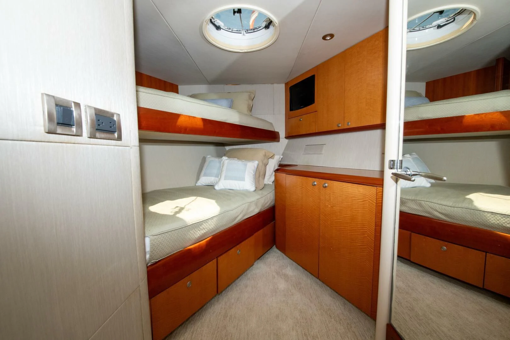 a room with a bed and a desk aboard STARFIRE Yacht for Sale