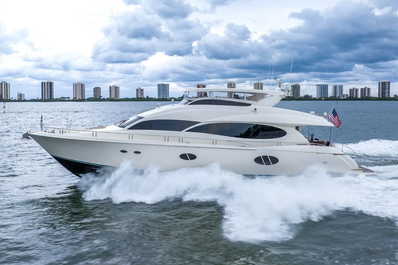 a white yacht on the water aboard STARFIRE Yacht for Sale