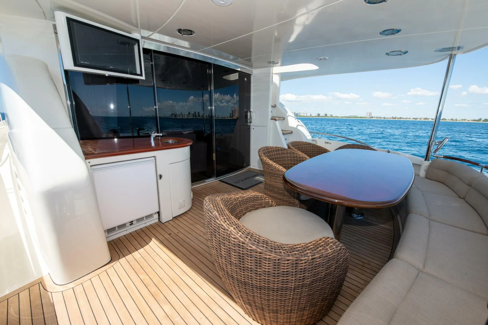 a room with a table and chairs aboard STARFIRE Yacht for Sale