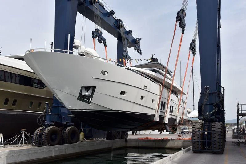 a large white boat with a large white boat on the deck aboard FRIDAY Yacht for Sale