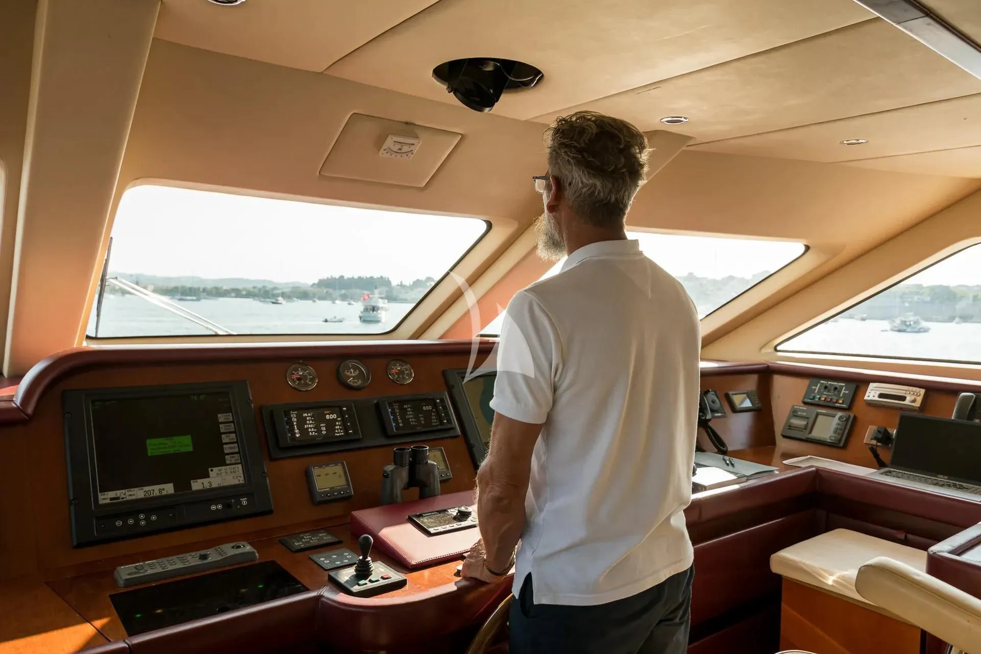 a man standing in front of a control panel aboard ENDLESS SUMMER Yacht for Sale