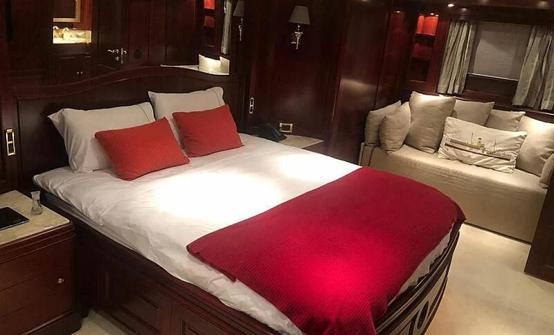 a room with a bed and a couch aboard ENDLESS SUMMER Yacht for Sale