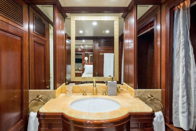 a bathroom with a sink and a mirror aboard ENDLESS SUMMER Yacht for Sale