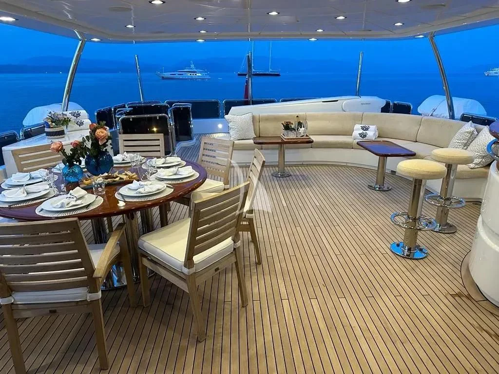 a room with tables and chairs aboard ENDLESS SUMMER Yacht for Sale