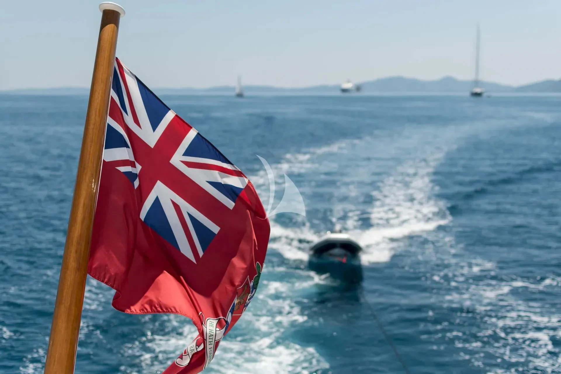 a boat with a flag on it aboard ENDLESS SUMMER Yacht for Sale