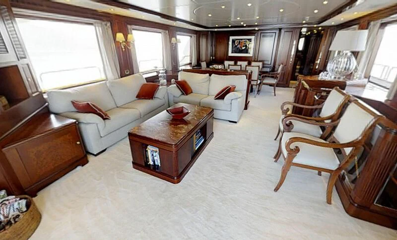 a living room with a couch and a coffee table aboard ENDLESS SUMMER Yacht for Sale