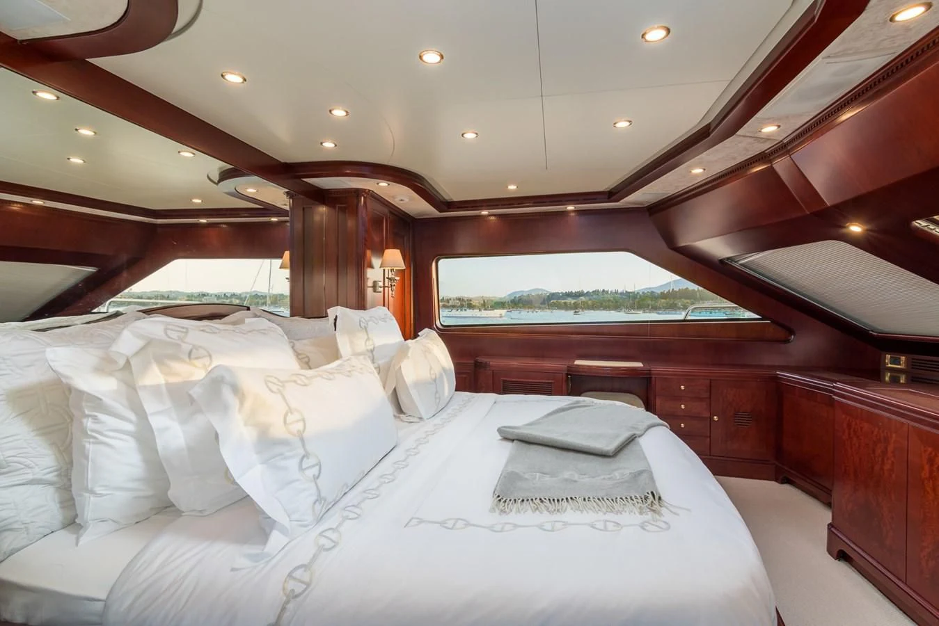a room with beds and a view of the water aboard ENDLESS SUMMER Yacht for Sale