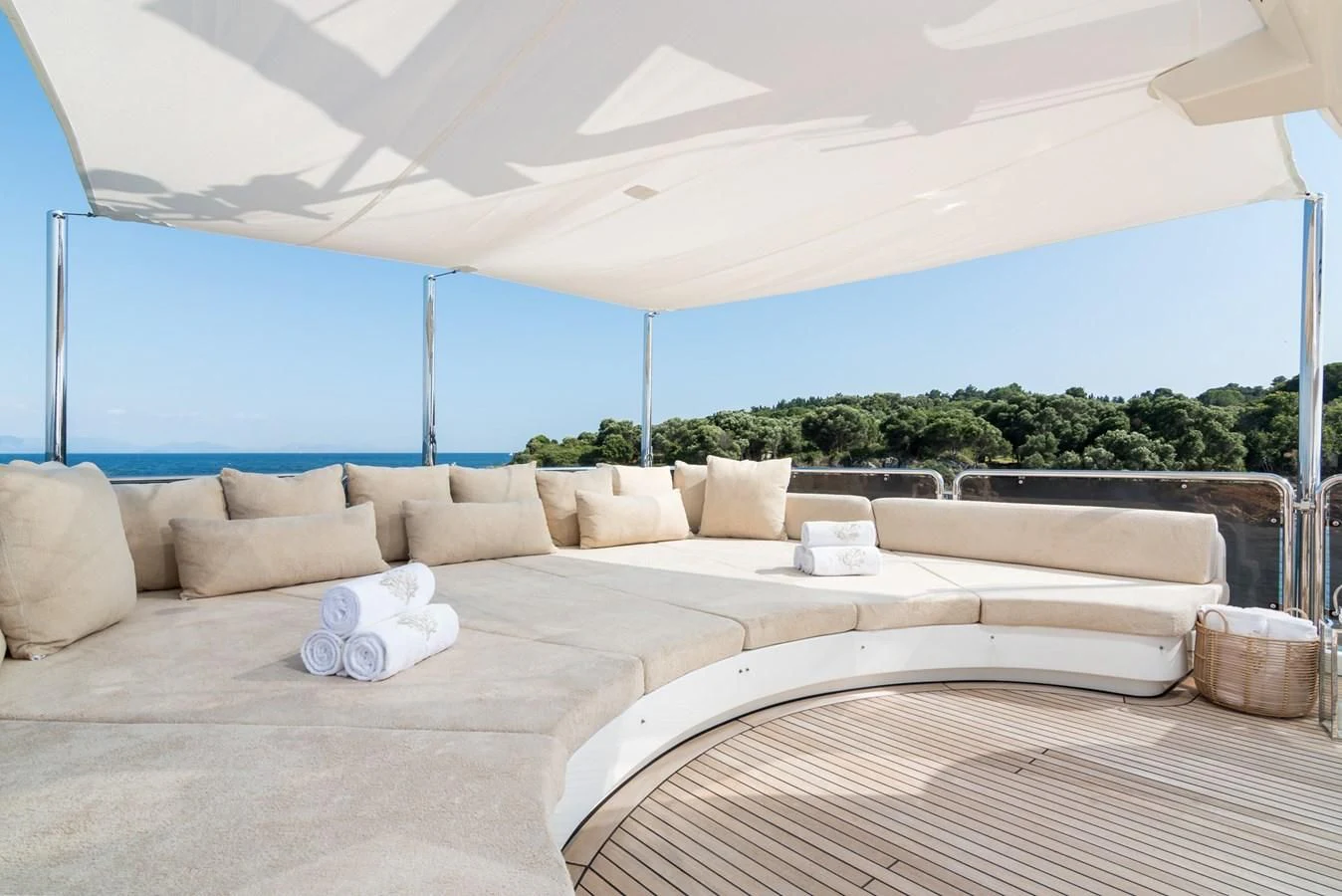 a large white couch with a large white bed in front of a large blue ocean aboard ENDLESS SUMMER Yacht for Sale