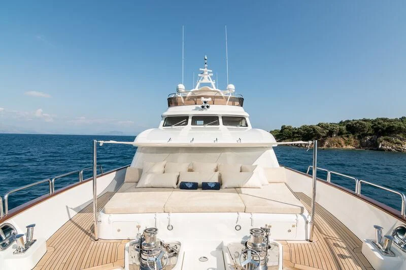 a white boat on a body of water aboard ENDLESS SUMMER Yacht for Sale