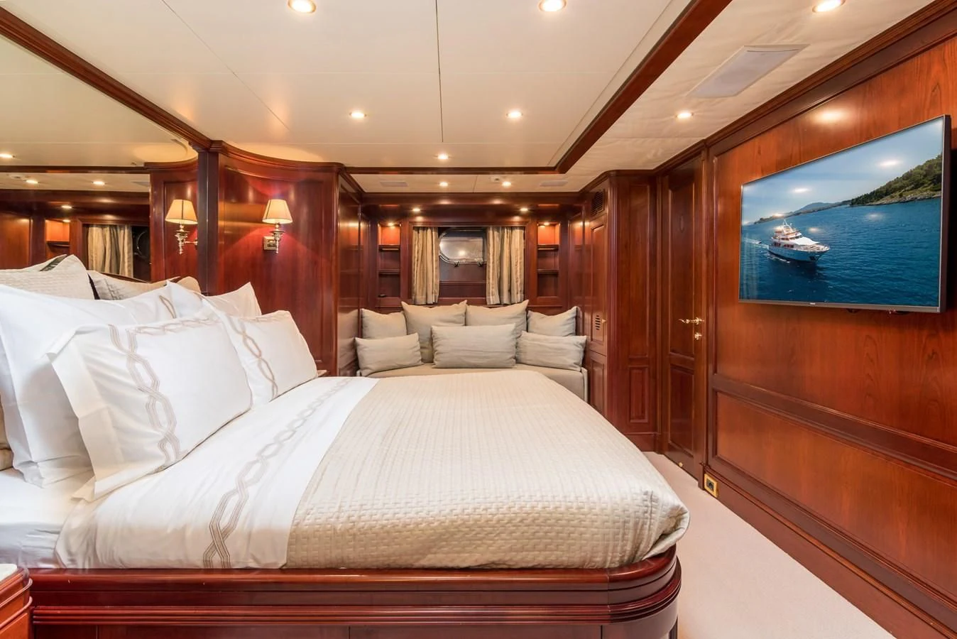 a bed with white sheets aboard ENDLESS SUMMER Yacht for Sale