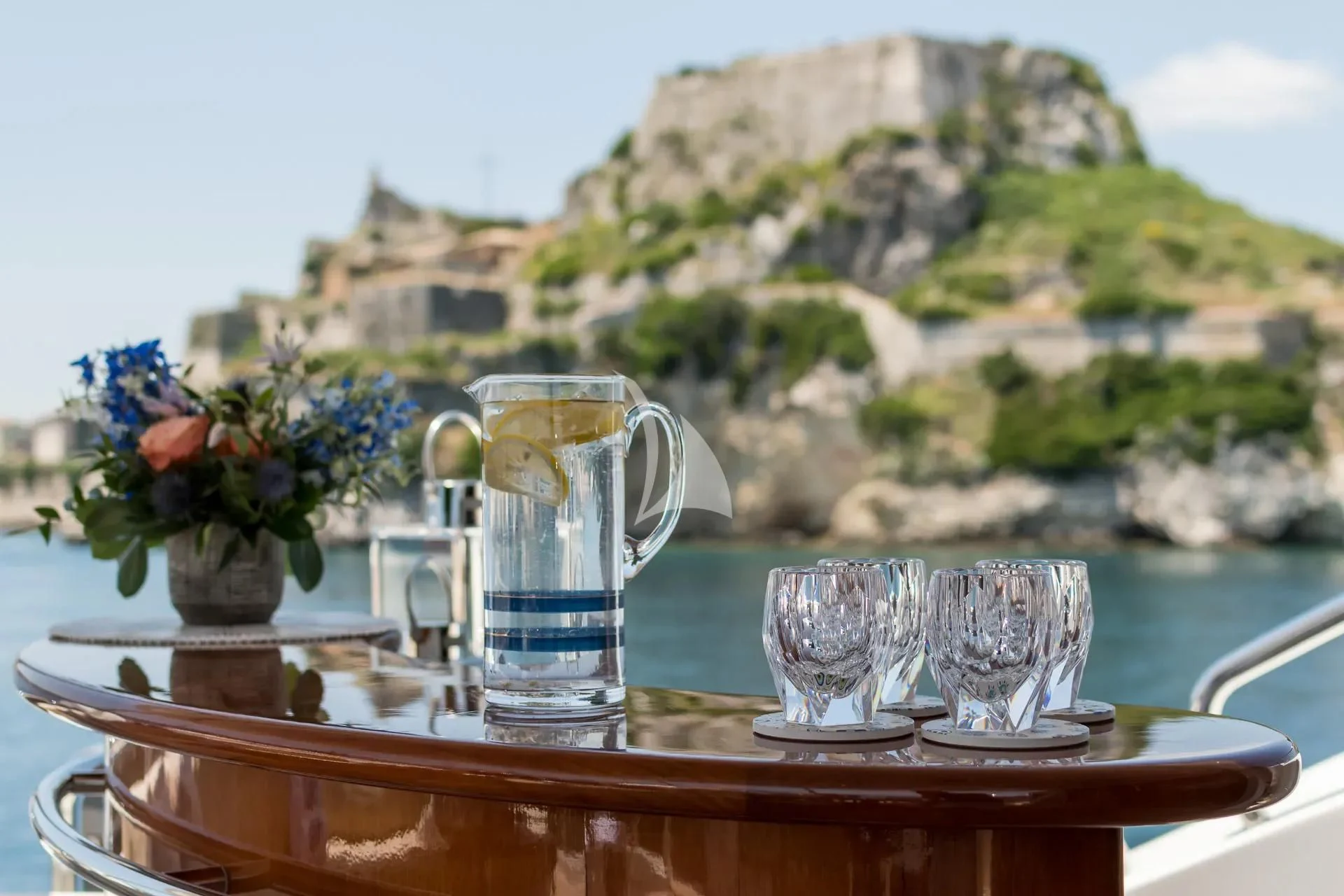 a table with glasses and a glass on it aboard ENDLESS SUMMER Yacht for Sale