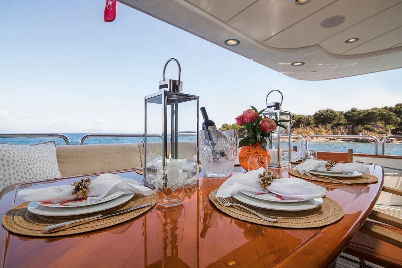 a table with plates and glasses on it aboard ENDLESS SUMMER Yacht for Sale