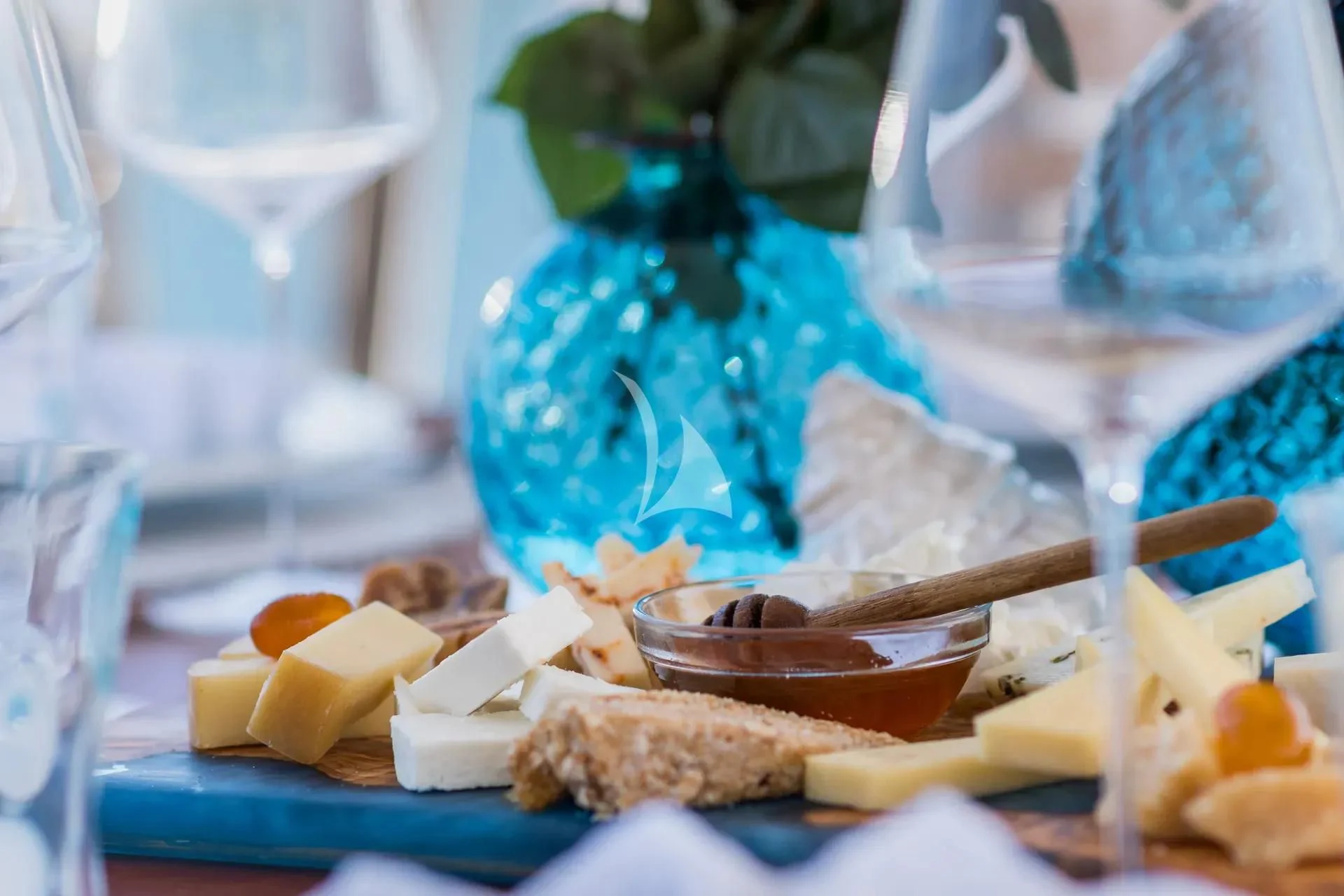 a glass vase with a bowl of cheese and crackers aboard ENDLESS SUMMER Yacht for Sale