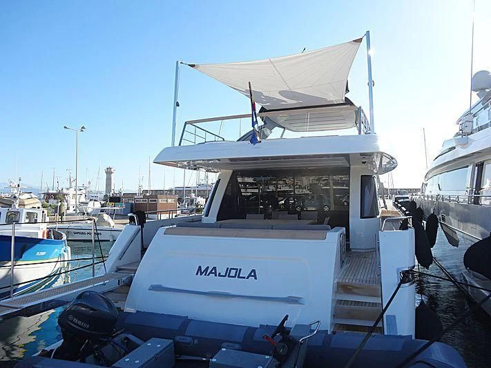 a boat docked at a pier aboard SEN Yacht for Sale