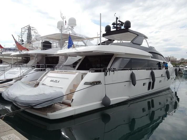 a couple of boats are parked in a harbor aboard SEN Yacht for Sale