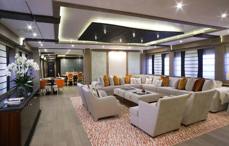 a living room with white couches aboard LADY M Yacht for Sale