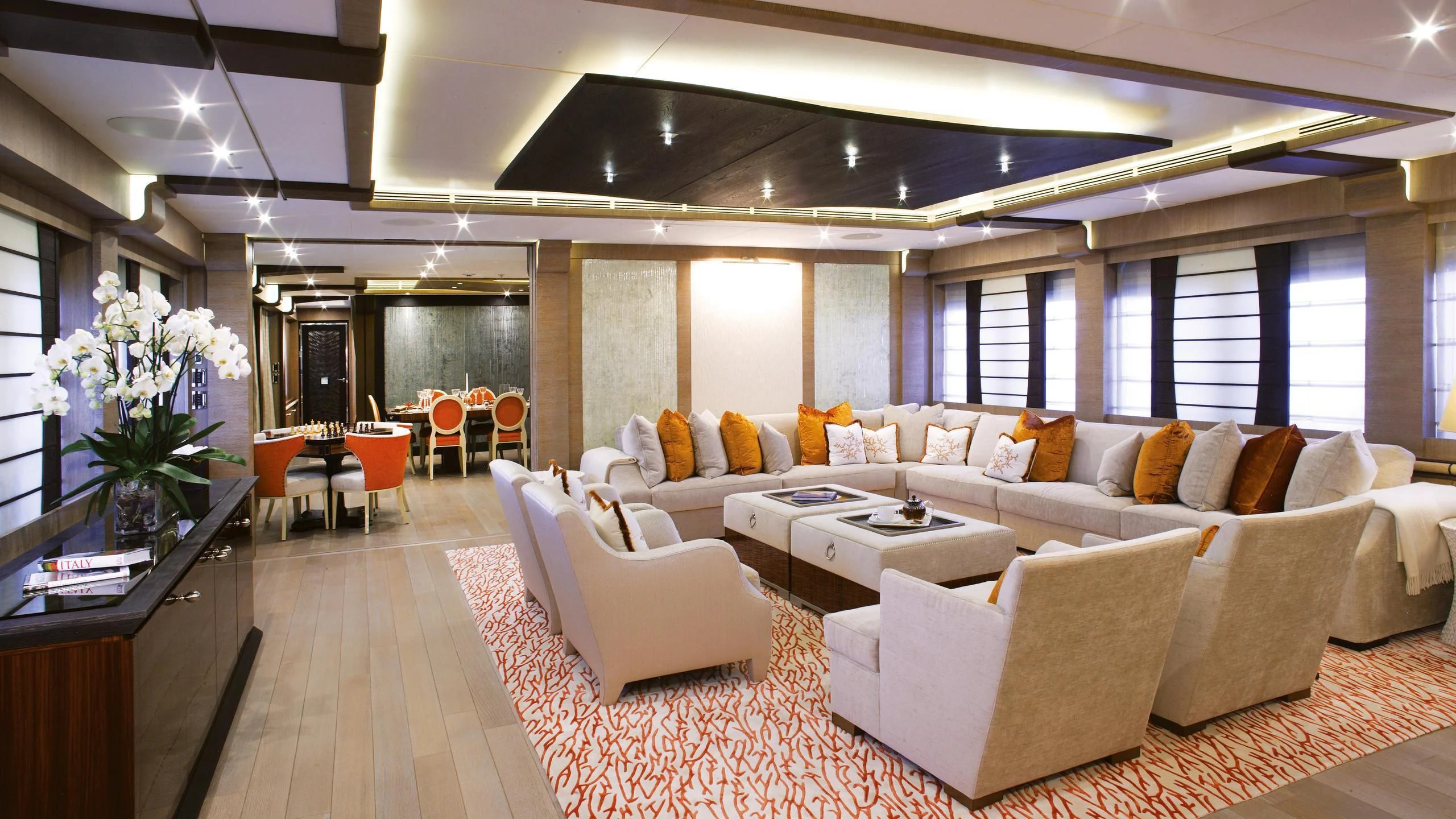 a living room with white couches aboard LADY M Yacht for Sale