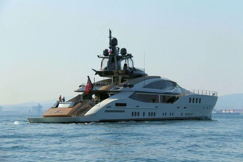 a large white boat in the water aboard LADY M Yacht for Sale
