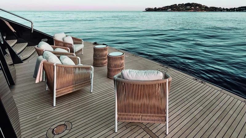 a deck with chairs on it by the water aboard ZAZOU Yacht for Sale