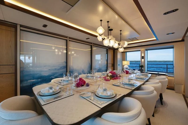 a large dining room with a large window aboard ZAZOU Yacht for Sale