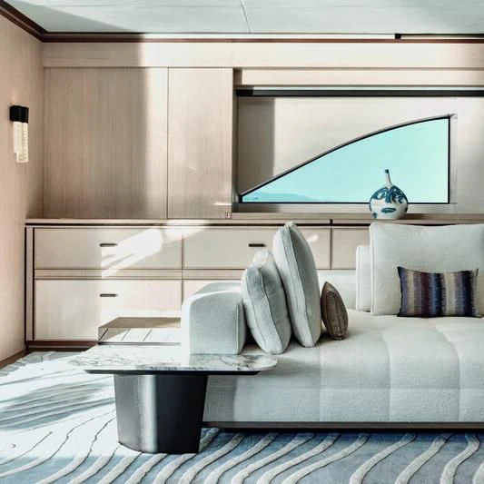 a white couch with a white pillow aboard ZAZOU Yacht for Sale