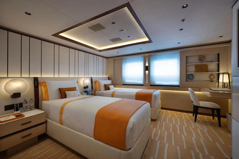 a room with a bed and a desk aboard ZAZOU Yacht for Sale