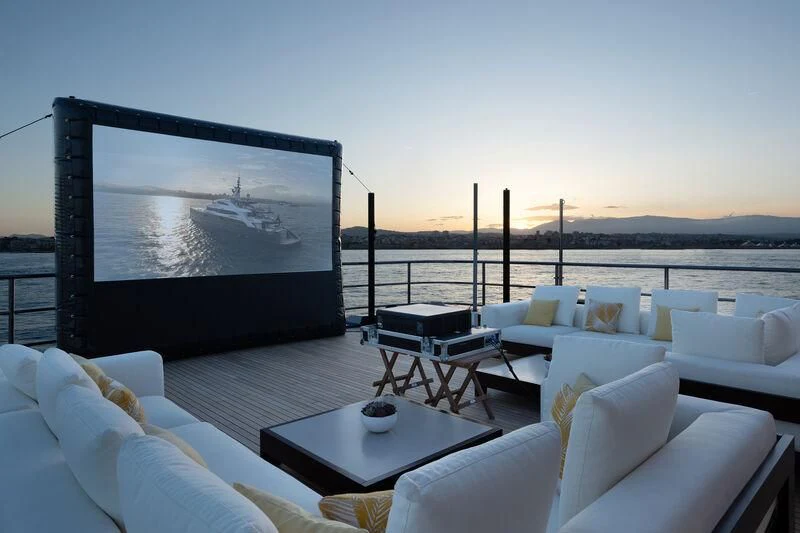 a living room with a large screen aboard ZAZOU Yacht for Sale