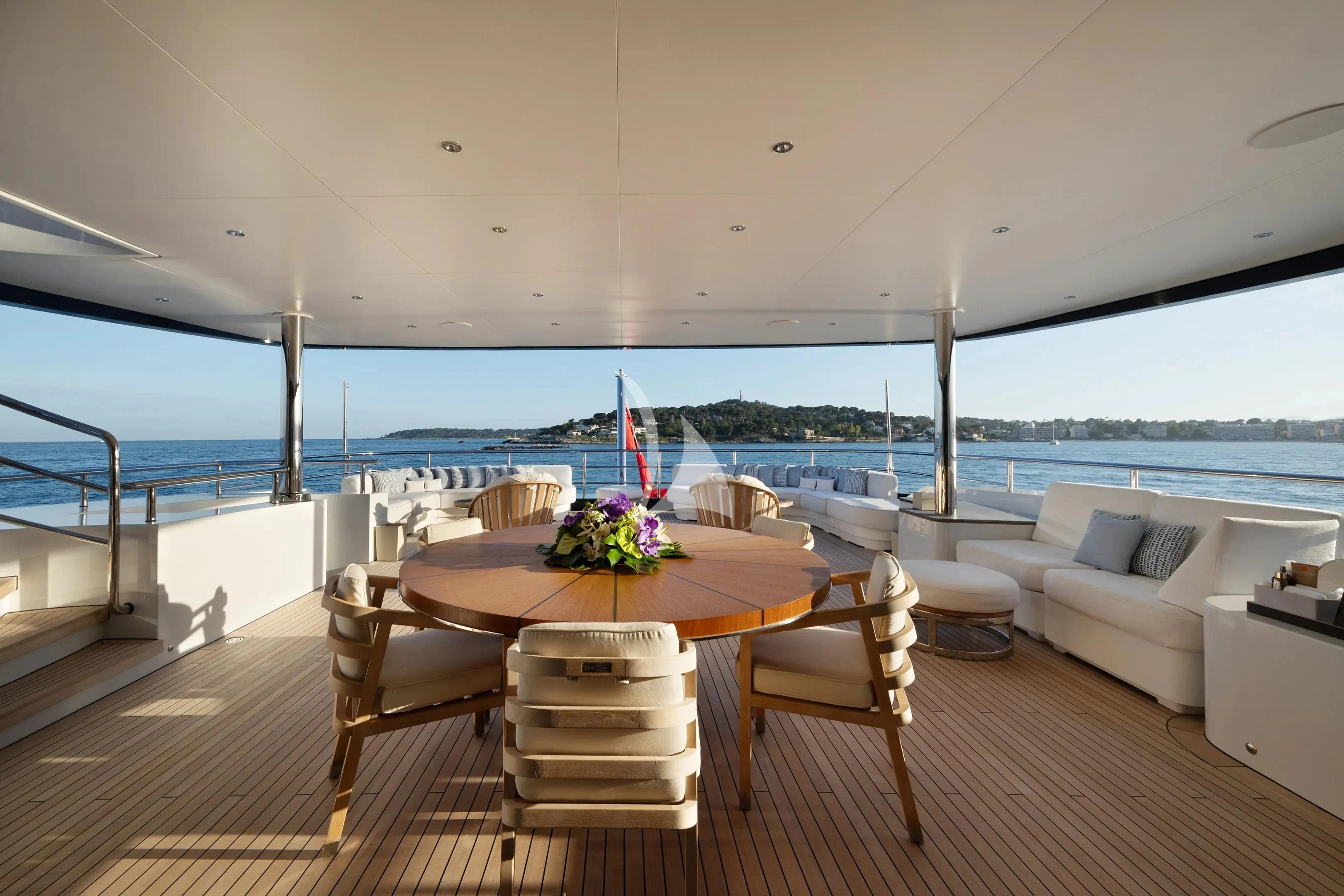 a table and chairs on a deck aboard ZAZOU Yacht for Sale