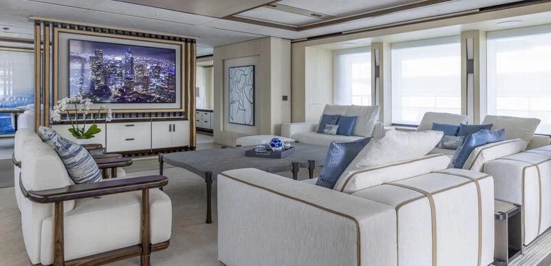 a living room with white couches aboard ZAZOU Yacht for Sale
