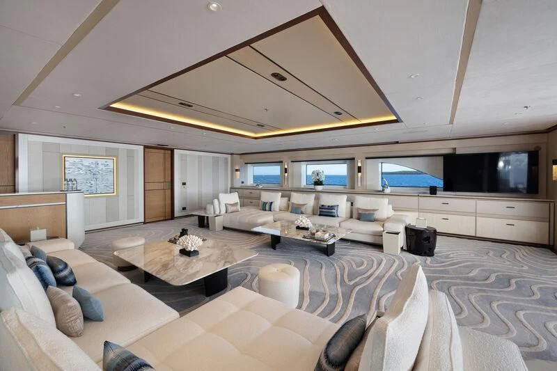 a large living room with a large bed and a large screen aboard ZAZOU Yacht for Sale