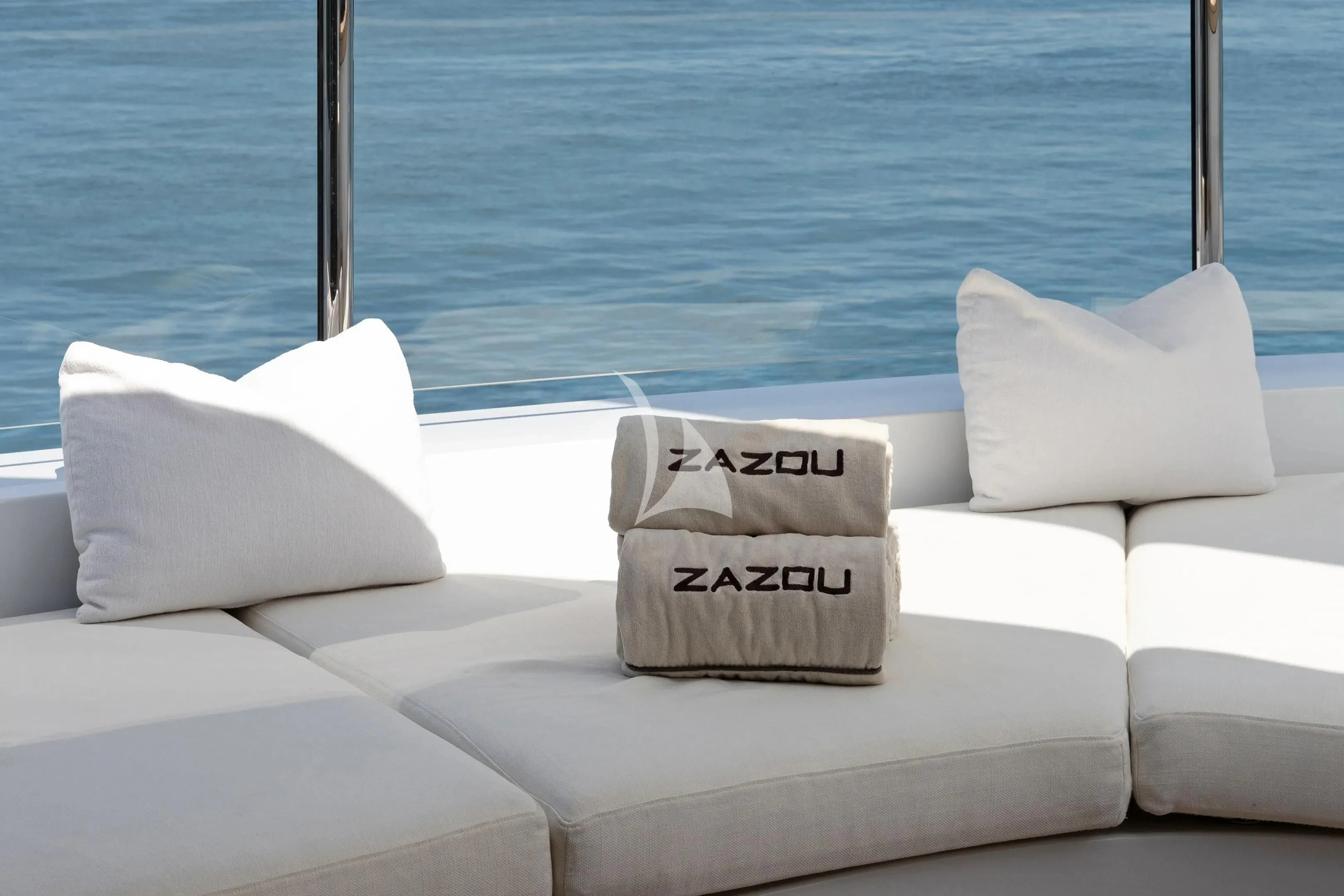 a white couch with pillows on it aboard ZAZOU Yacht for Sale