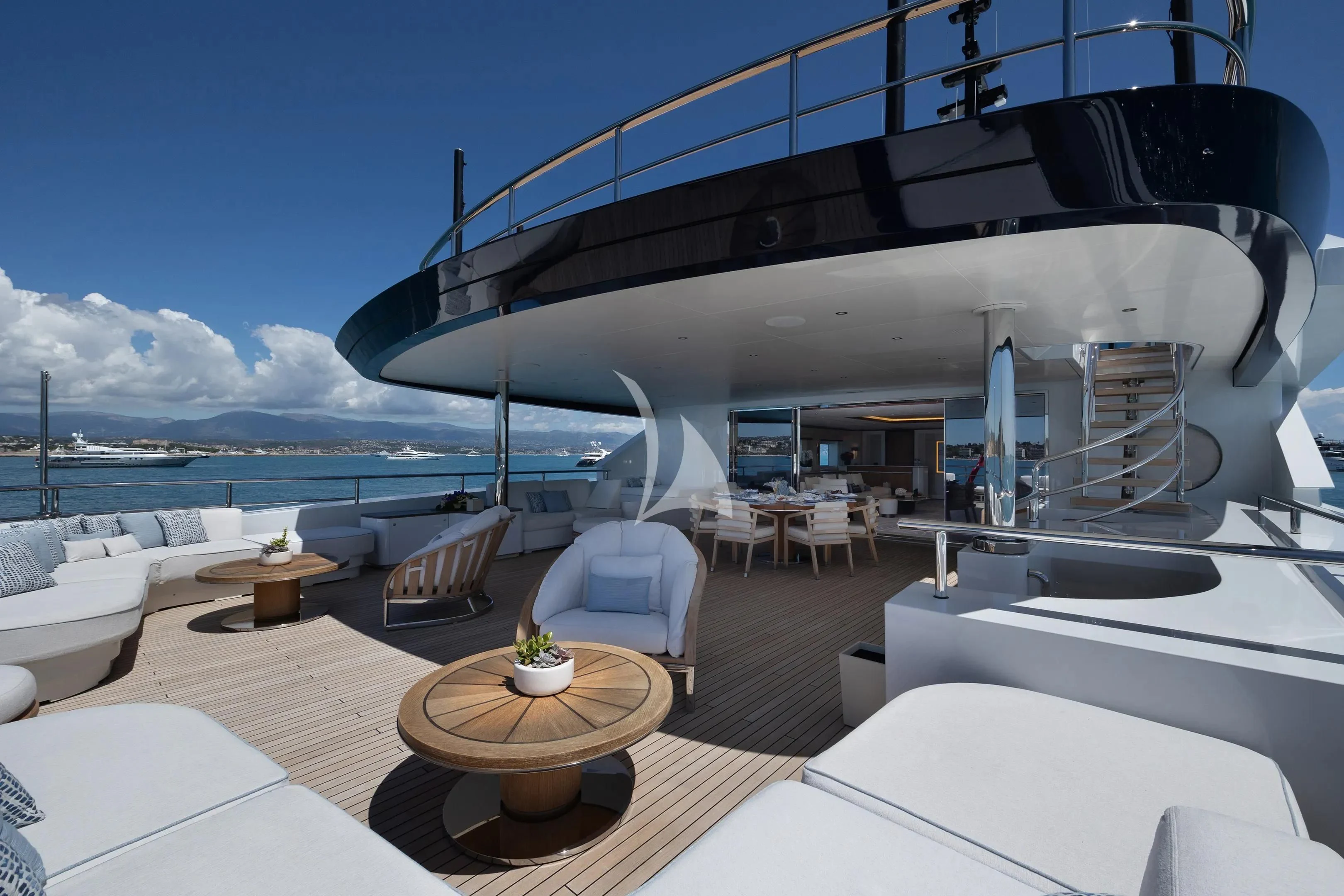 a room with a large balcony overlooking the ocean aboard ZAZOU Yacht for Sale