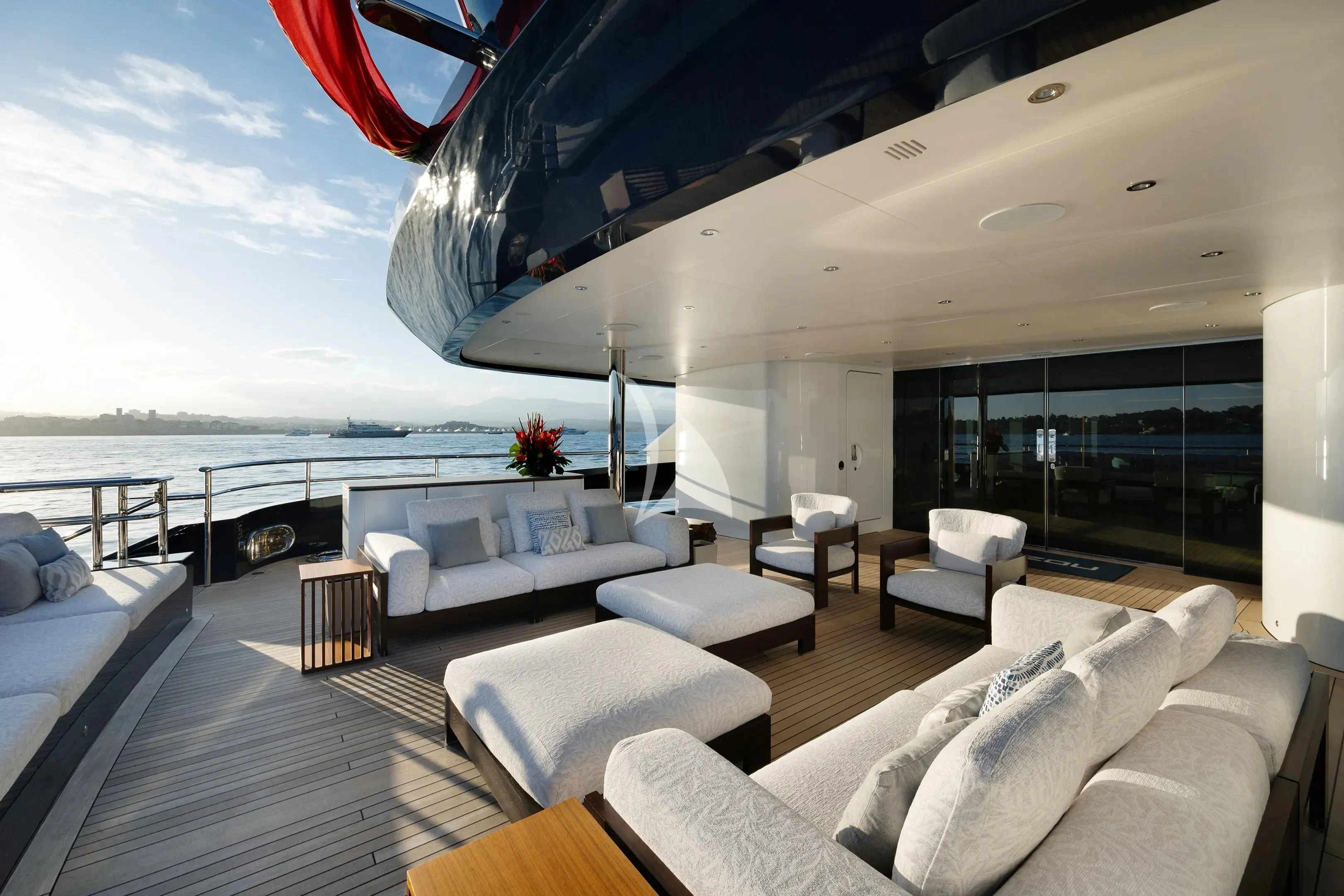 a large living room with a large balcony overlooking the ocean aboard ZAZOU Yacht for Sale