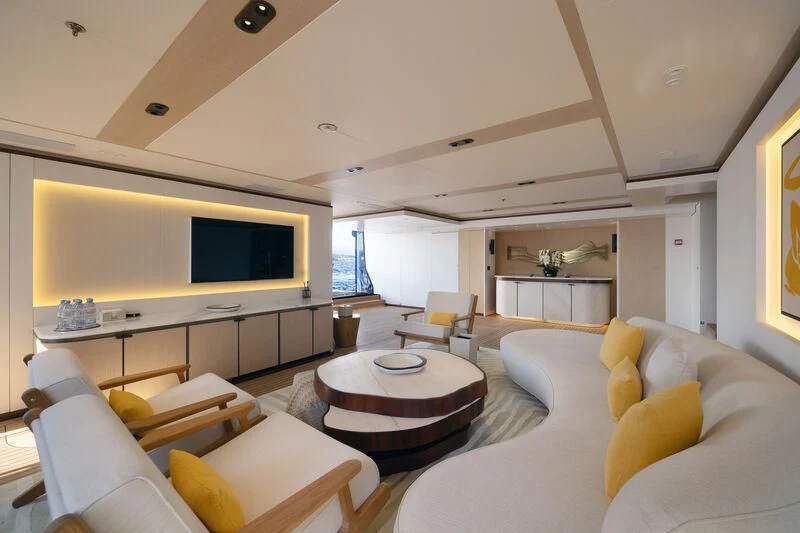 a living room with a large screen aboard ZAZOU Yacht for Sale