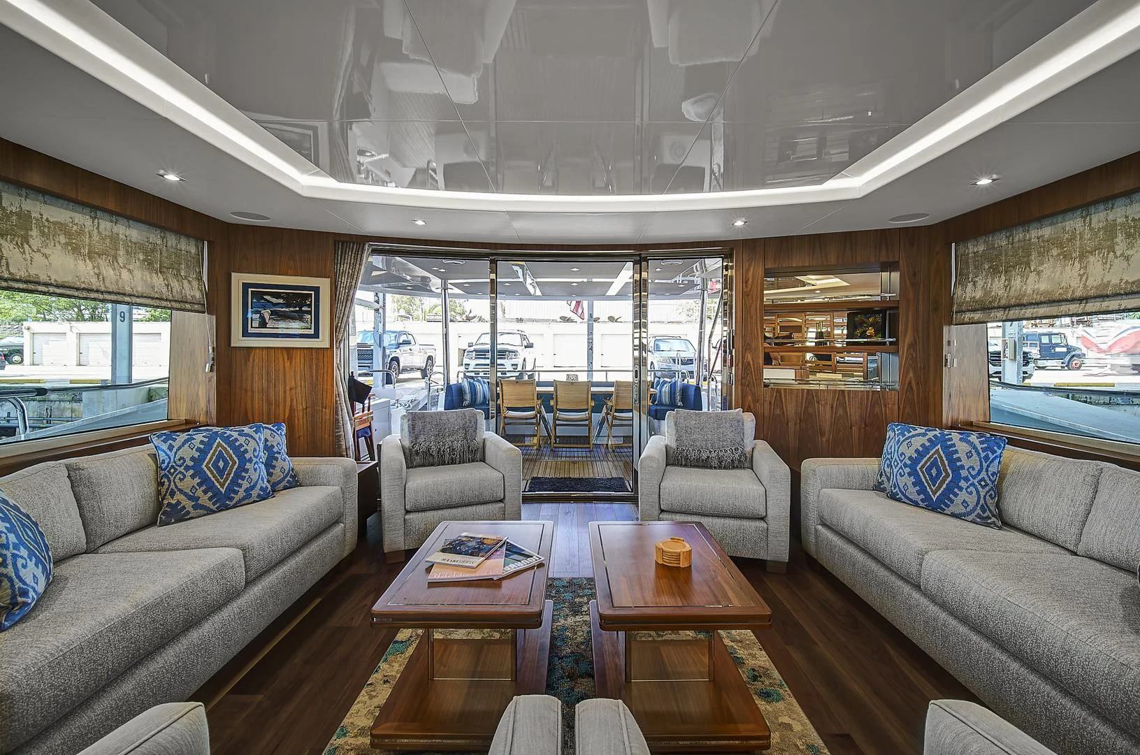a living room with a large window aboard 'S NOON SOMEWHERE Yacht for Sale