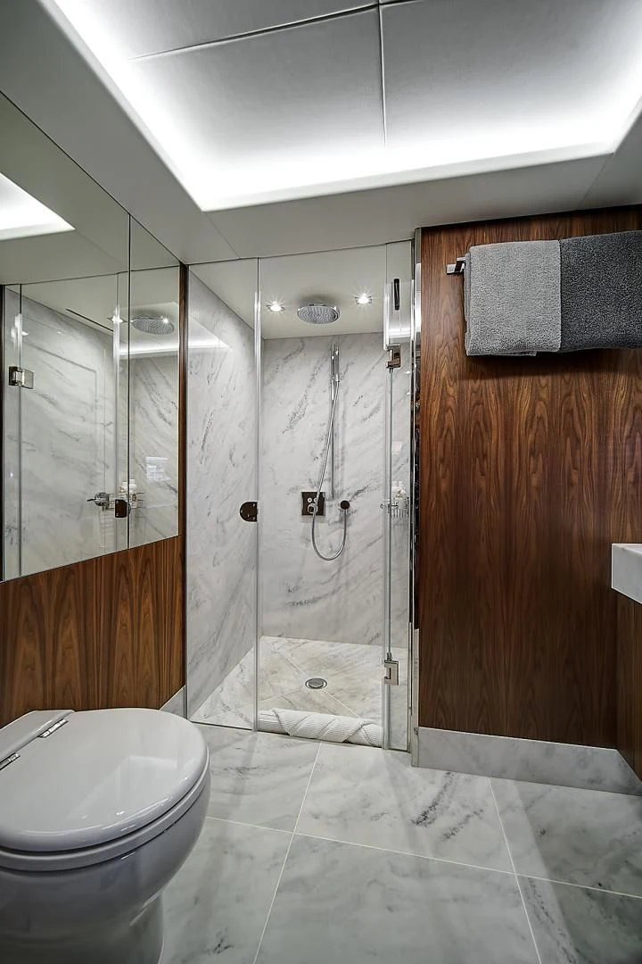 a bathroom with a glass shower aboard 'S NOON SOMEWHERE Yacht for Sale