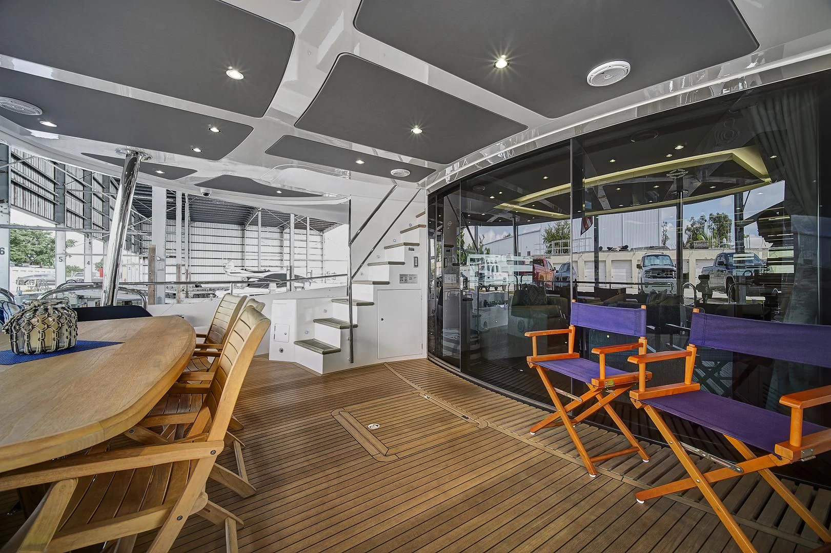 a room with tables and chairs aboard 'S NOON SOMEWHERE Yacht for Sale