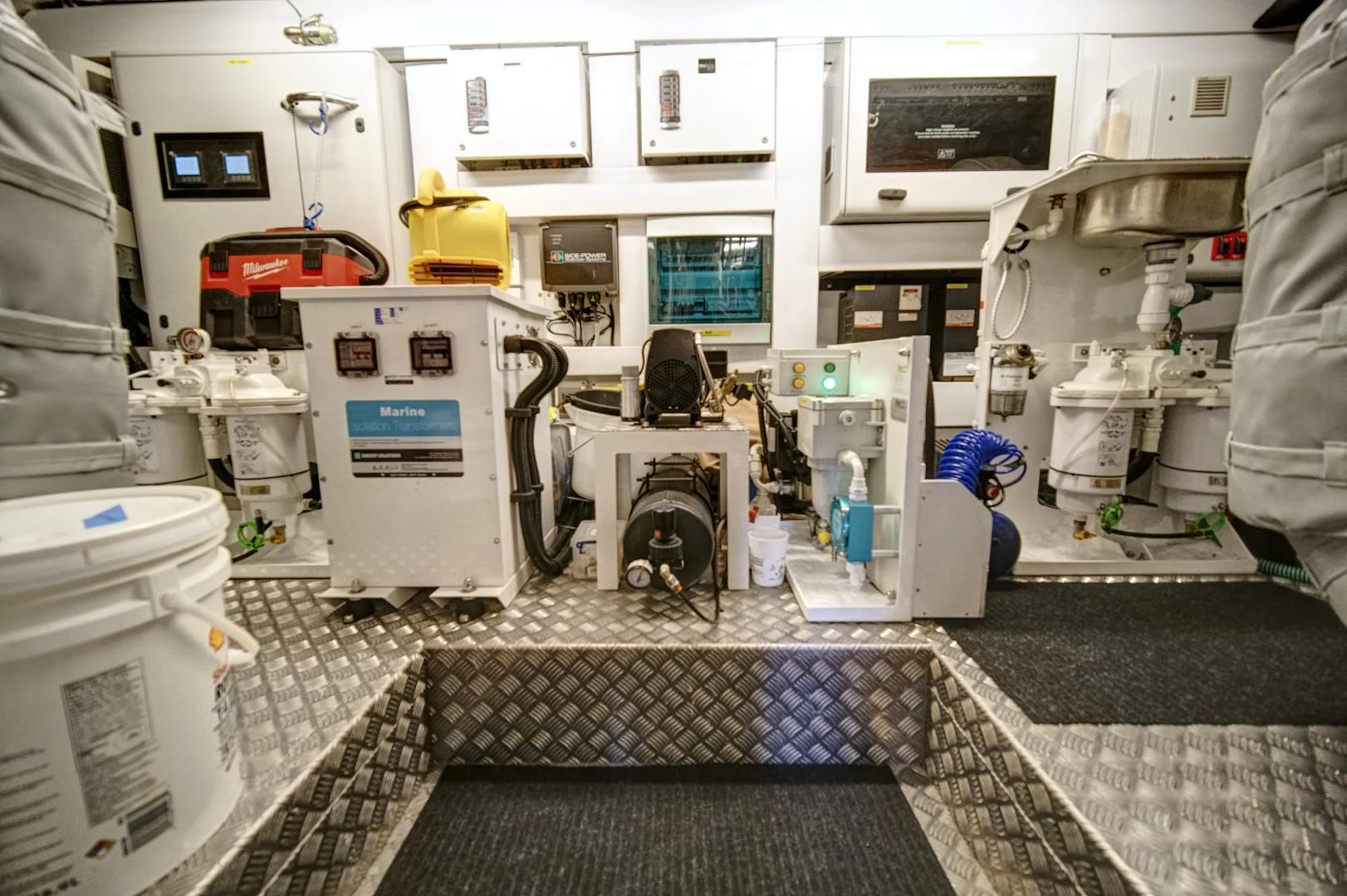 a few people working in a factory aboard 'S NOON SOMEWHERE Yacht for Sale