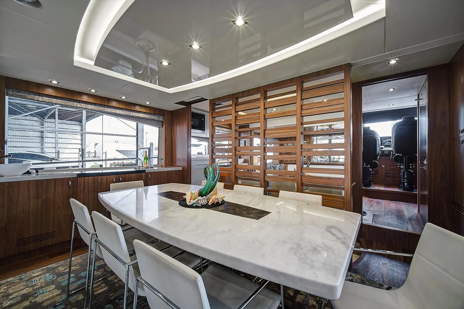 a room with a table and chairs aboard 'S NOON SOMEWHERE Yacht for Sale