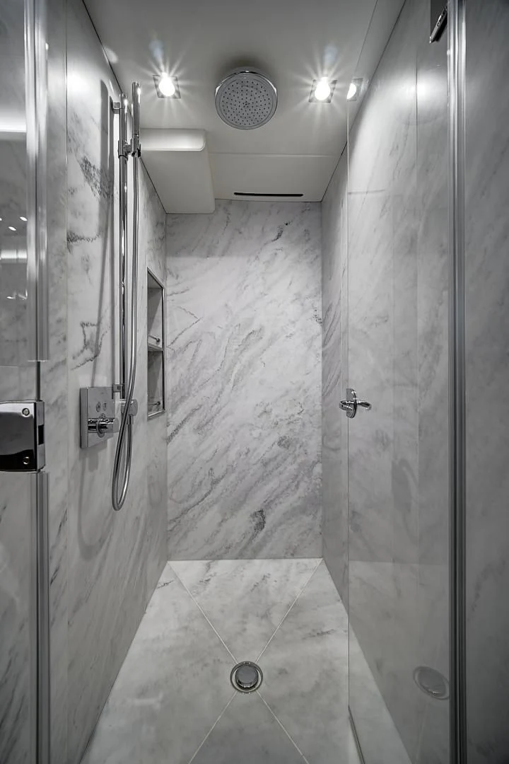 a bathroom with a shower unit and sink aboard 'S NOON SOMEWHERE Yacht for Sale