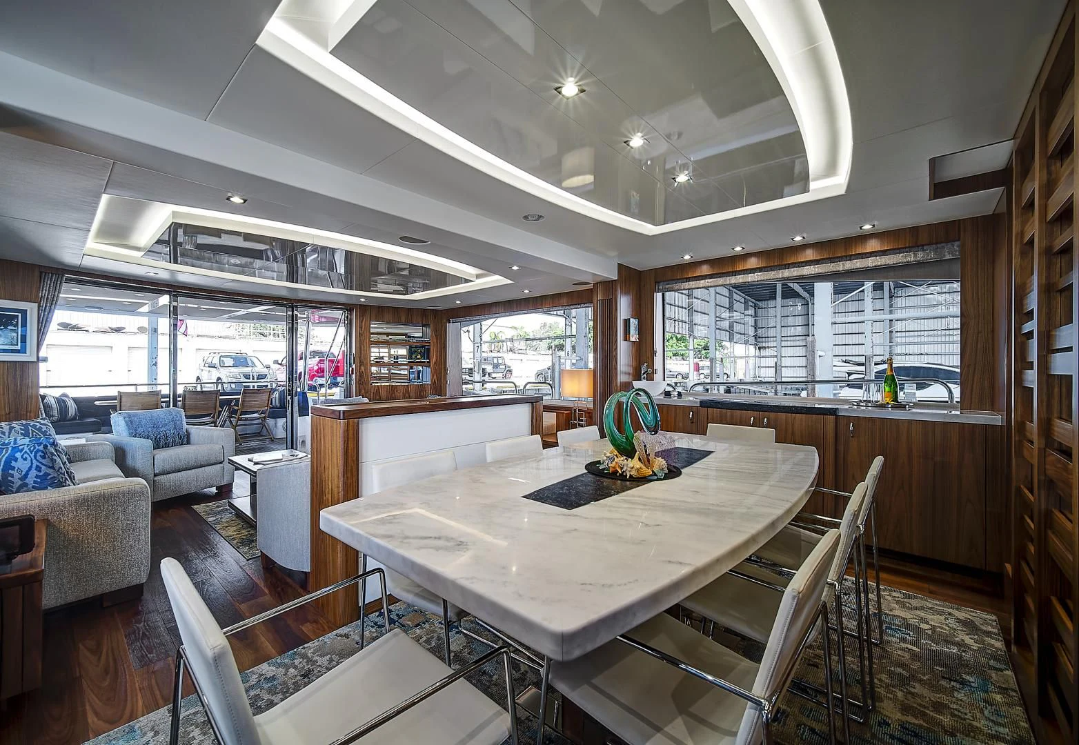 a large kitchen with a table aboard 'S NOON SOMEWHERE Yacht for Sale