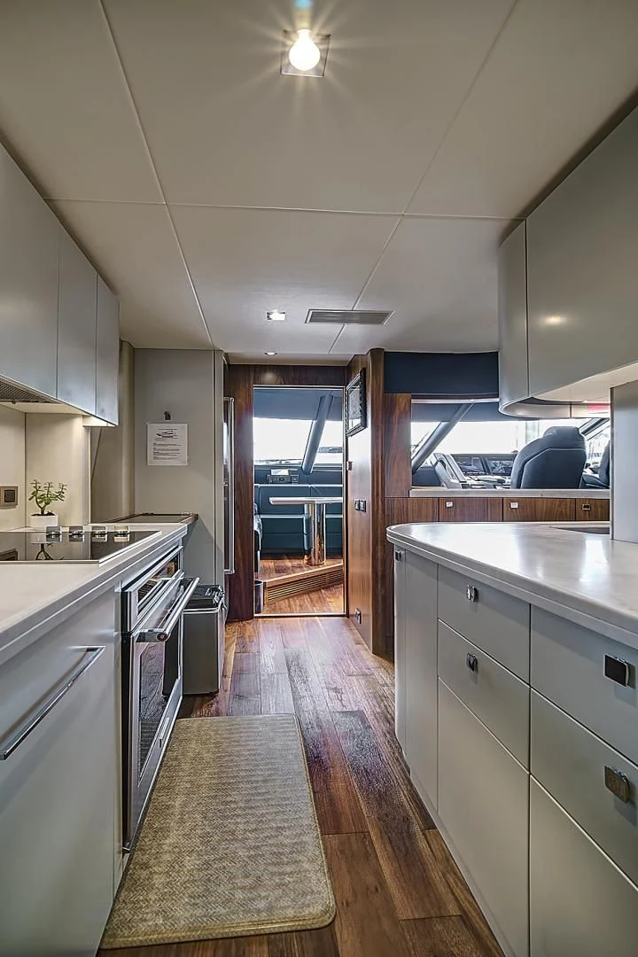 a kitchen with a large island aboard 'S NOON SOMEWHERE Yacht for Sale